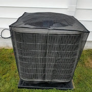 Black mesh cover on an outdoor condenser